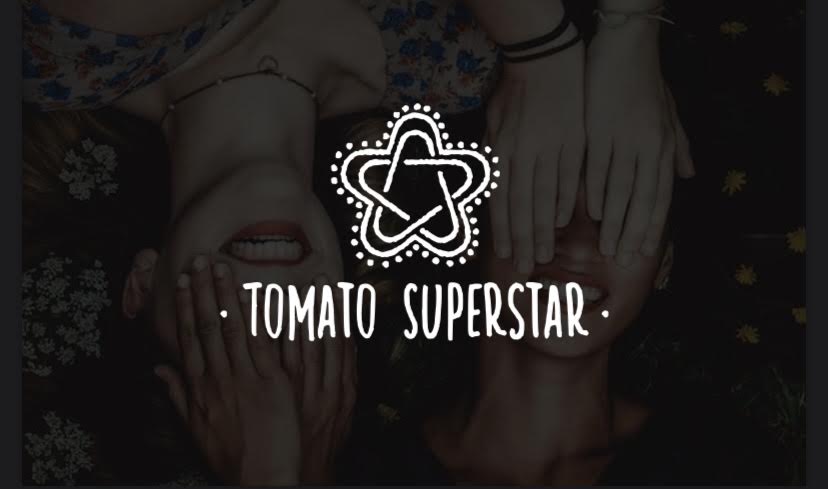 Two people lying down with hands covering faces, with a logo and text reading 'Tomato Superstar' above them.